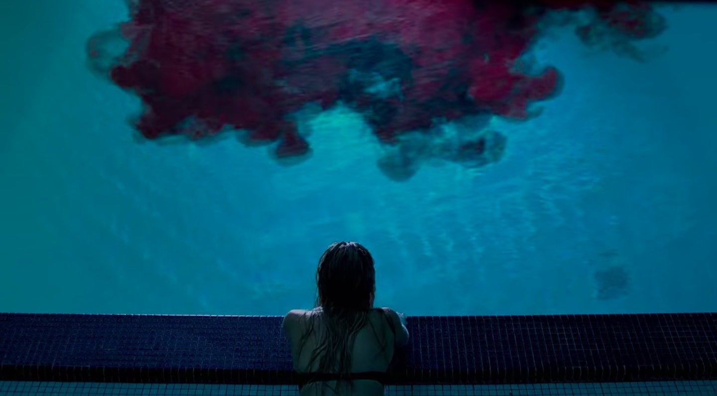 Jay staring at a swimming pool filling with blood in &quot;It Follows&quot;