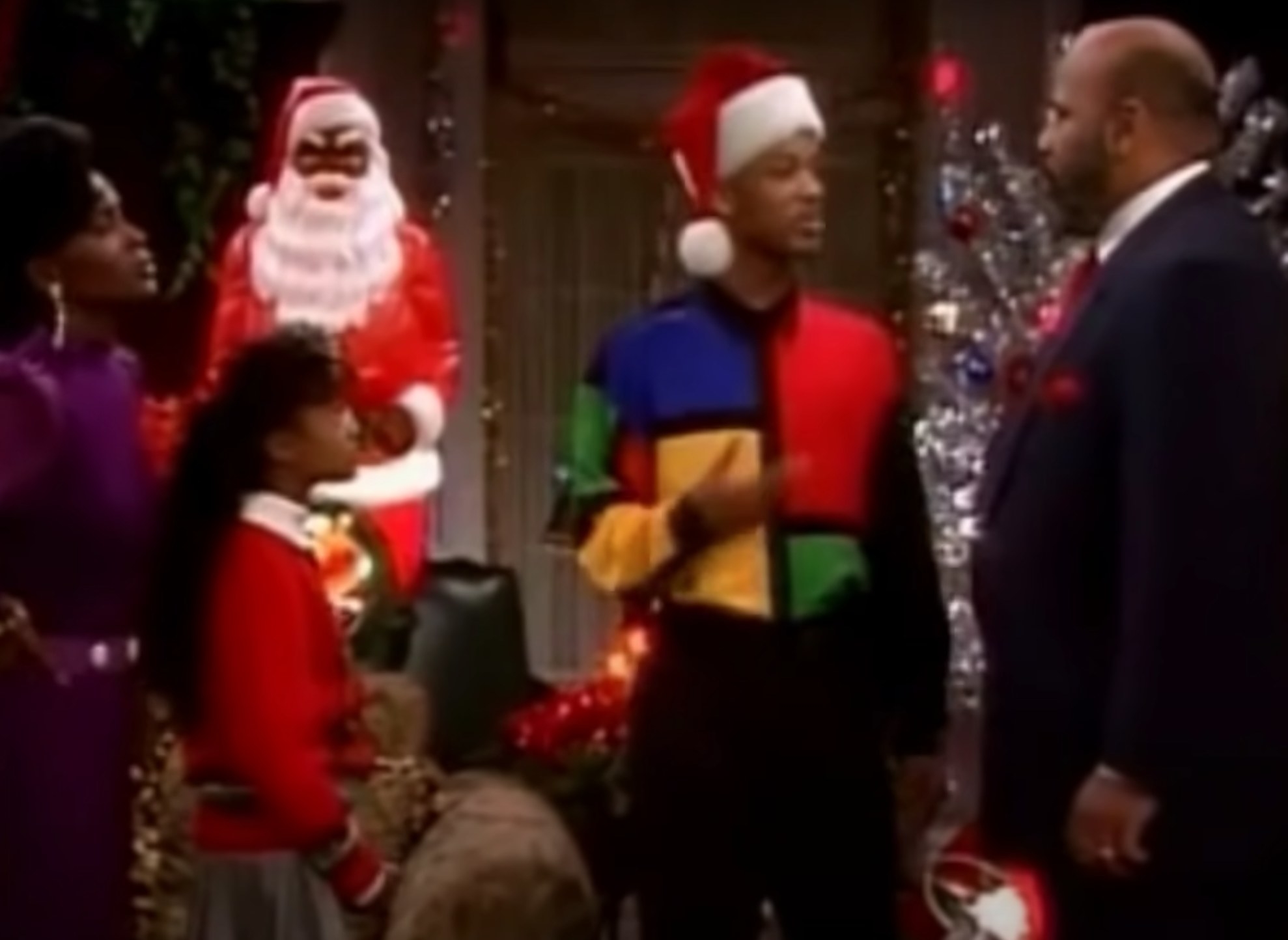 Vivian, Ashley, Will, and Uncle Phil talk in their festive family room in &quot;The Fresh Prince of Bel-Air&quot;
