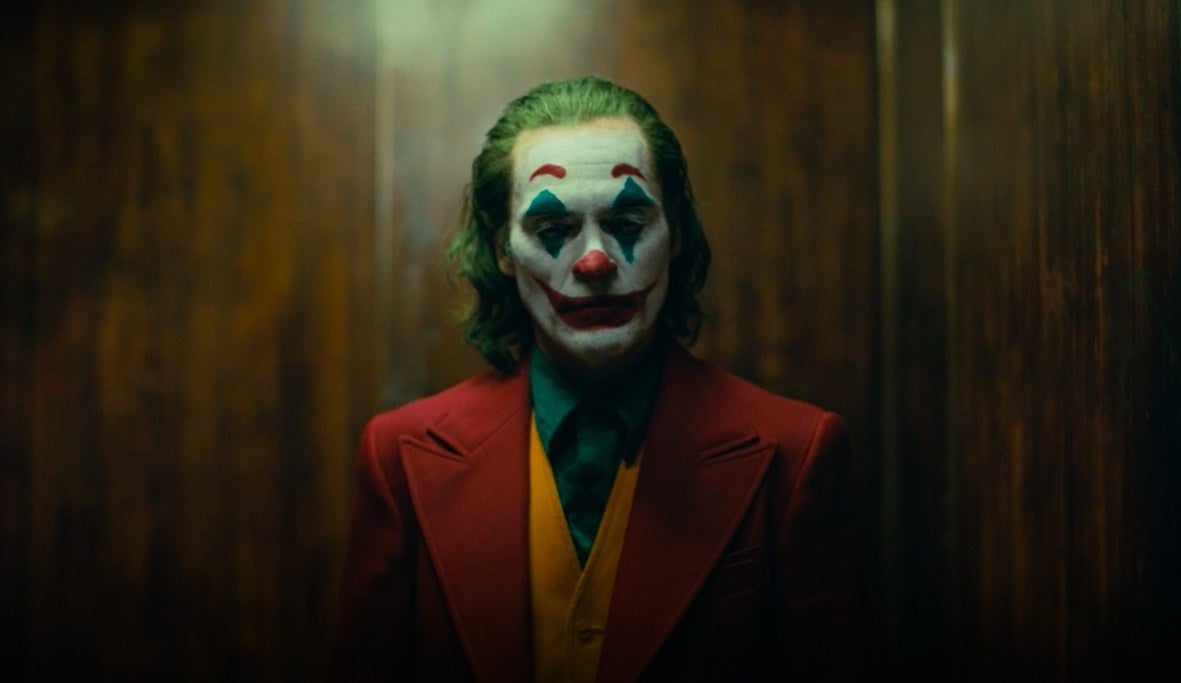 Arthur Fleck dressed as The Joker in an elevator in &quot;Joker&quot;