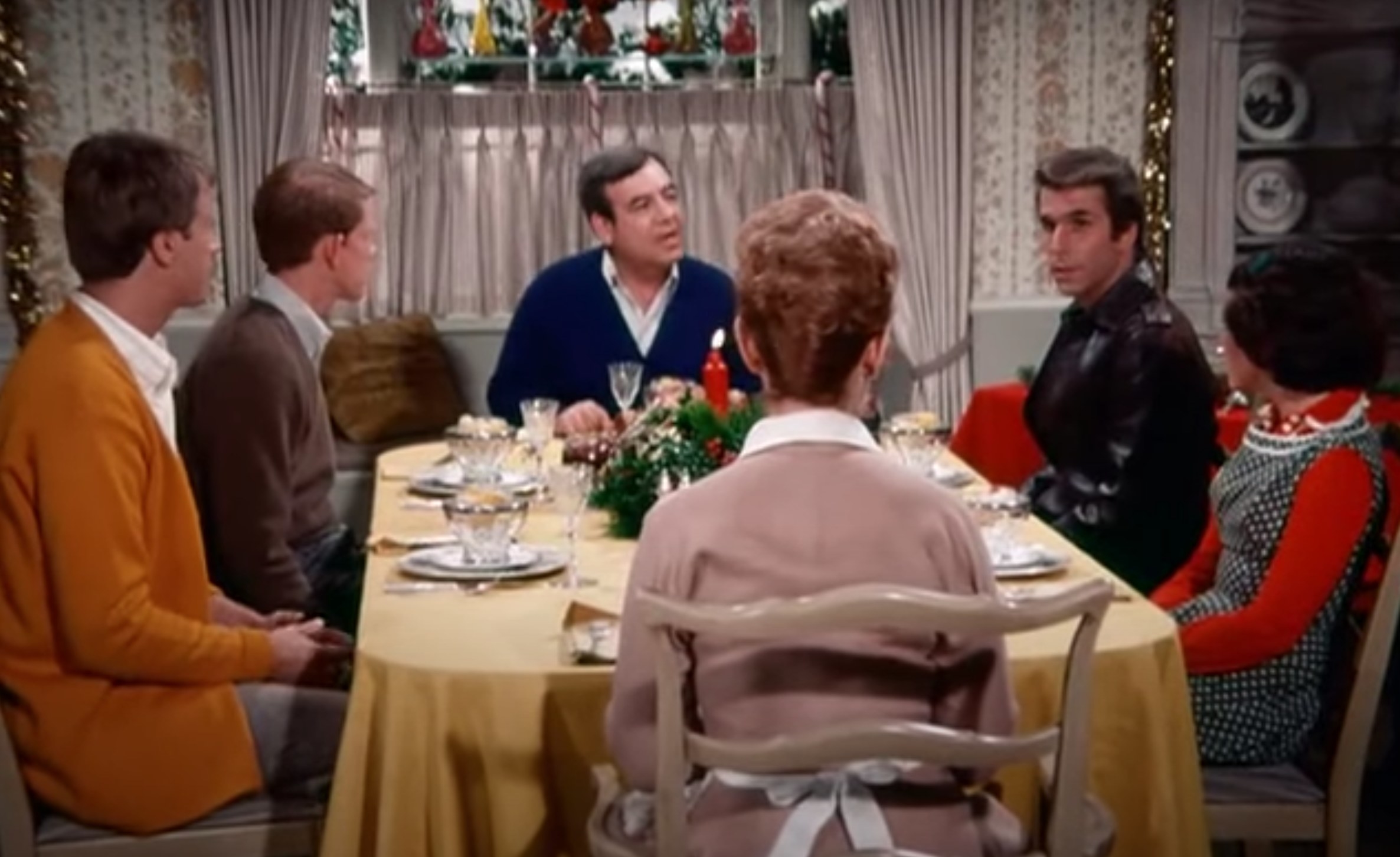The Cunninghams prepare for a Christmas meal with Fonzie in &quot;Happy Days&quot;