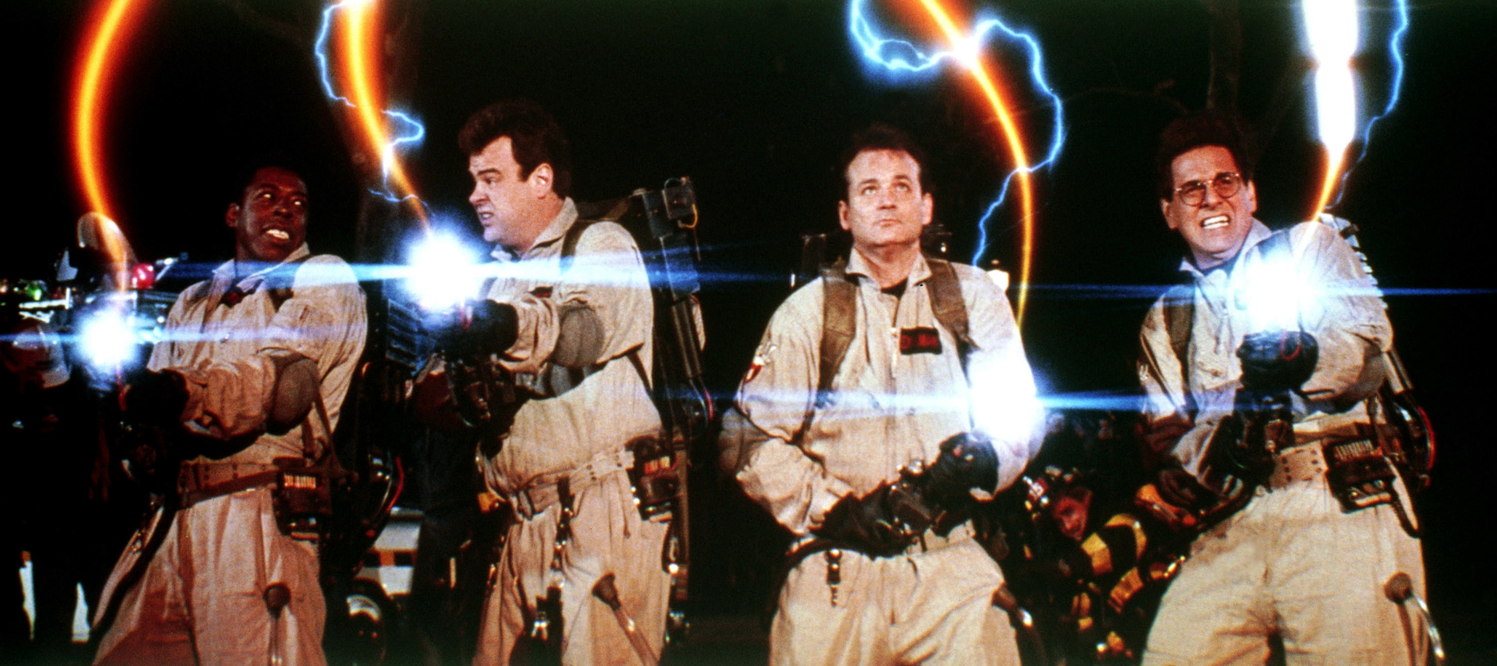 Ernie Hudson, Dan Aykroyd, Bill Murray, Harold Ramis as the Ghostbusters, blasting with their proton packs