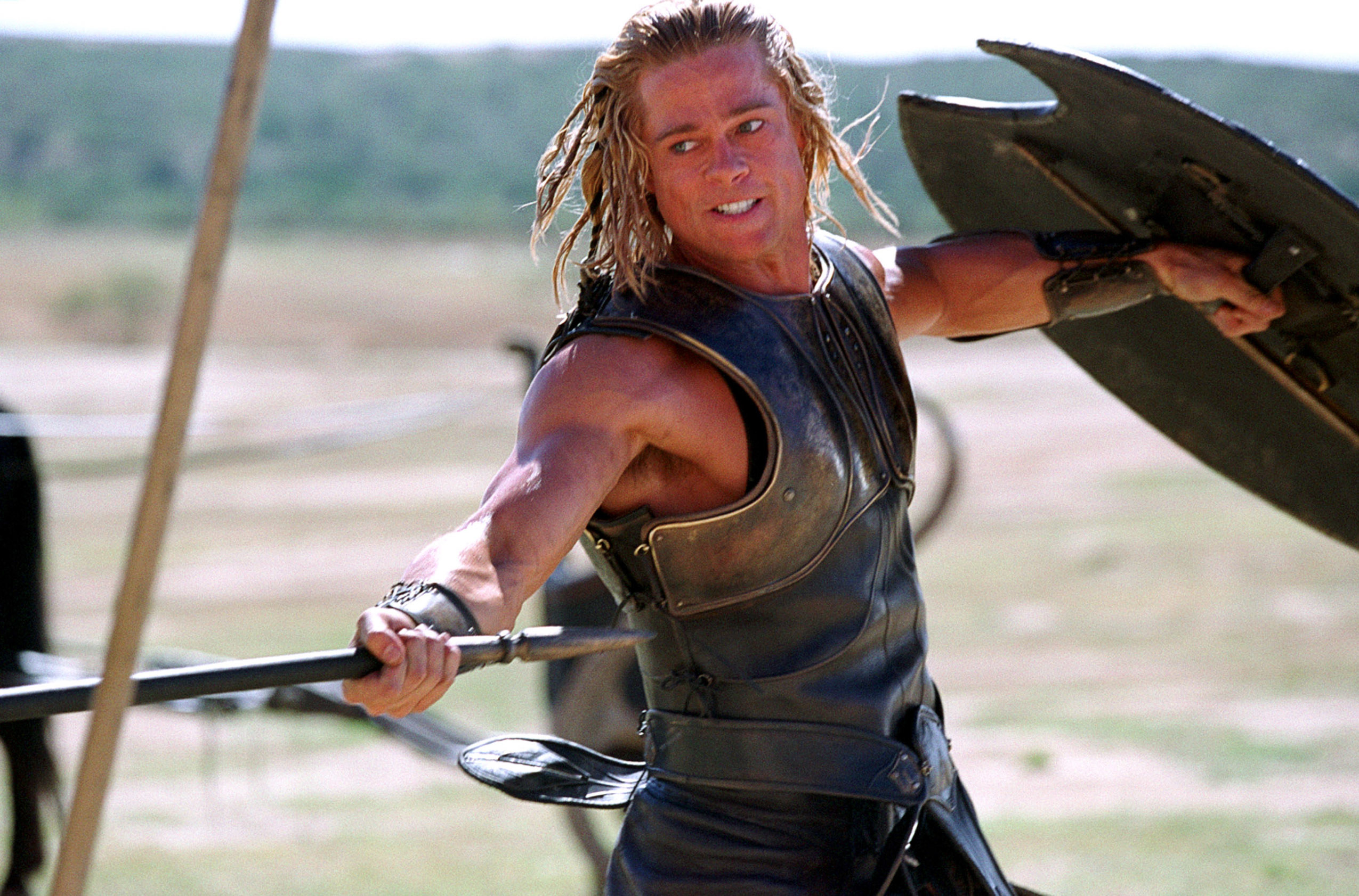 Brad Pitt as Achilles, wielding a spear in battle