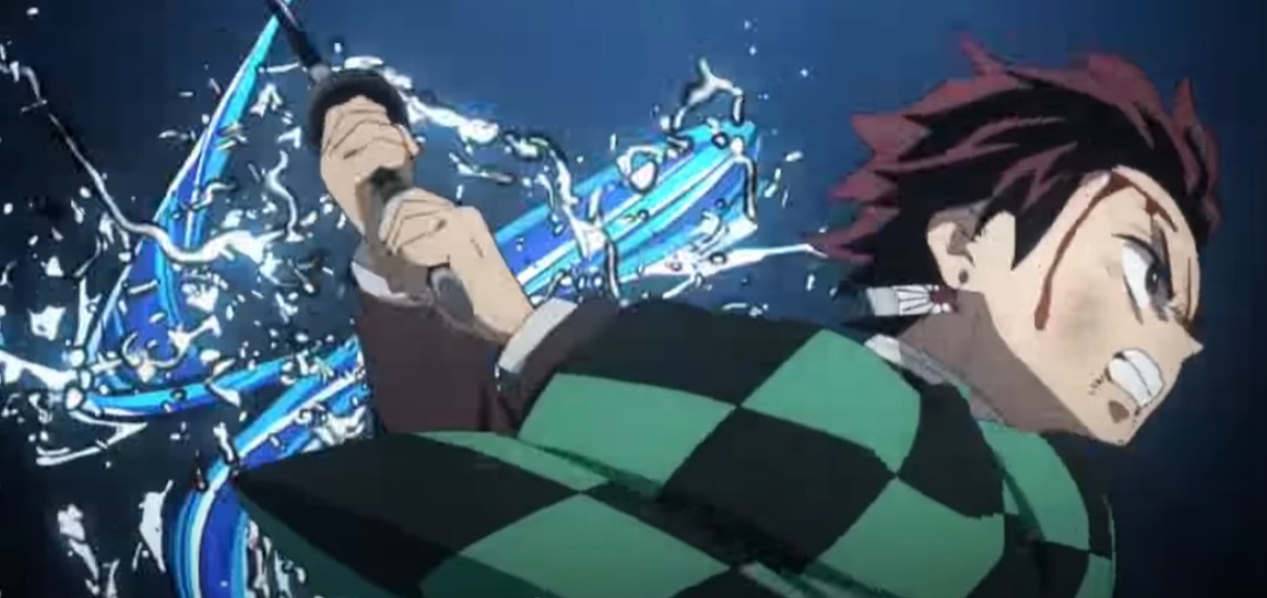 A bloodied Tanjiro using his water breathing technique to attack