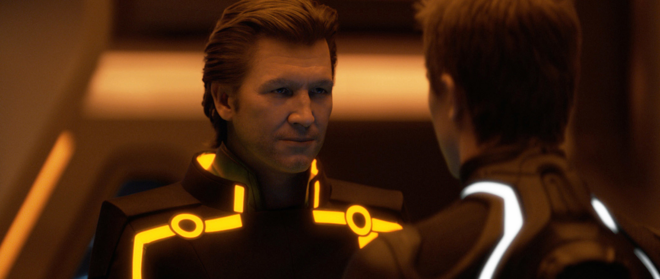 Jeff Bridges, Garrett Hedlund having a serious talk wearing futuristic suits with lights