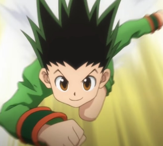 Gon dashing towards somebody with a grin on his face