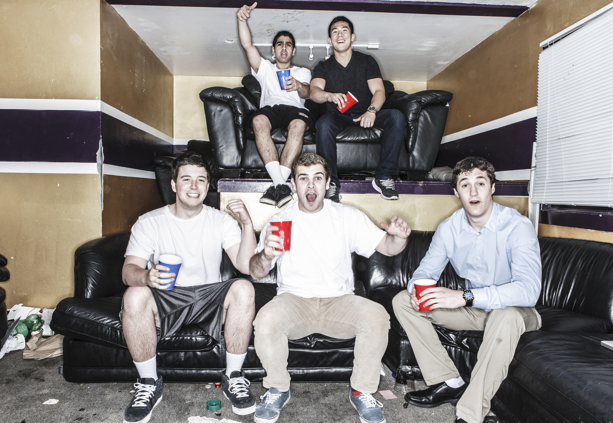 frat boys drinking on a couch