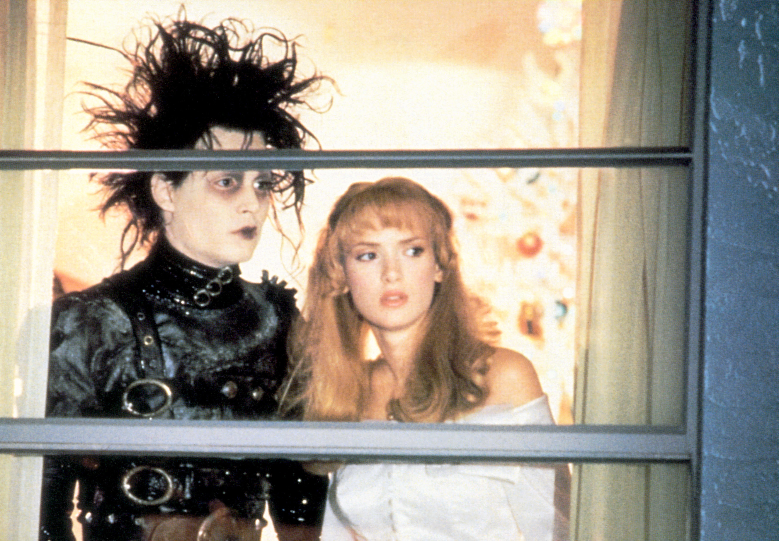 Johnny Depp and Winona Ryder look out a window together