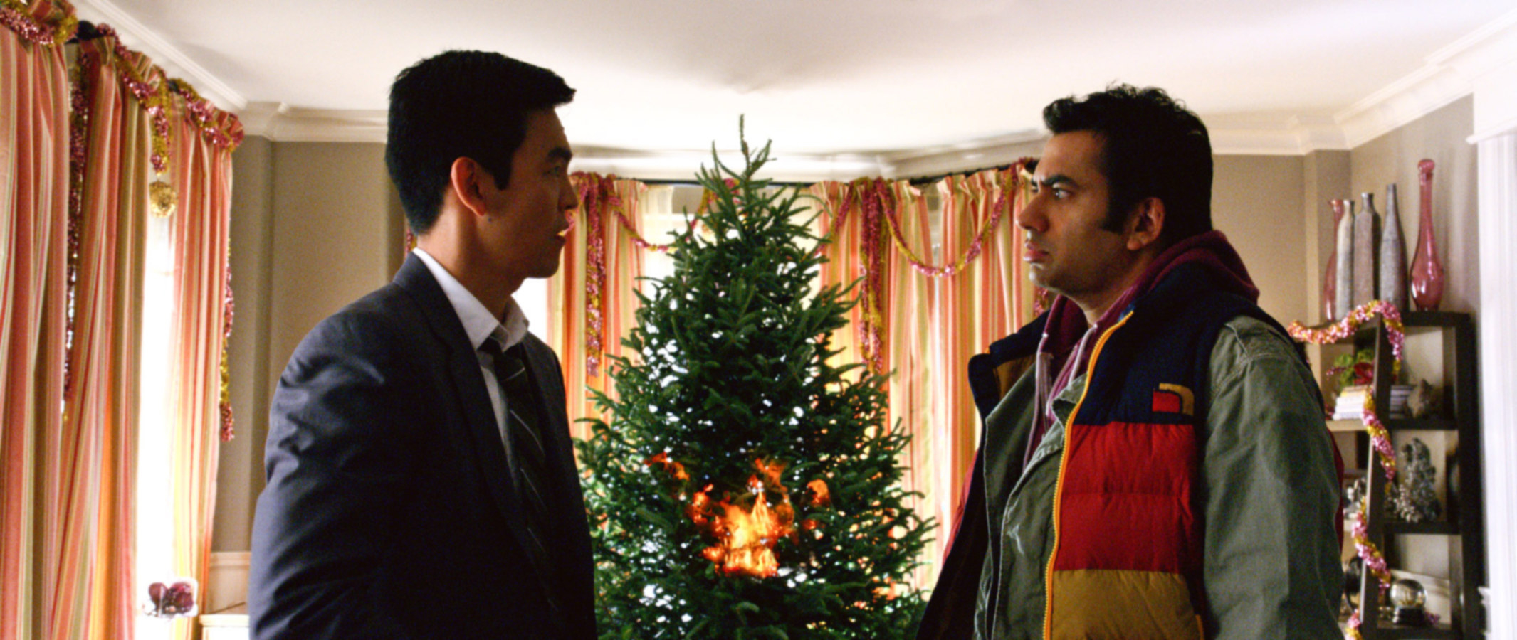 Harold and Kumar with a Christmas Tree in between them