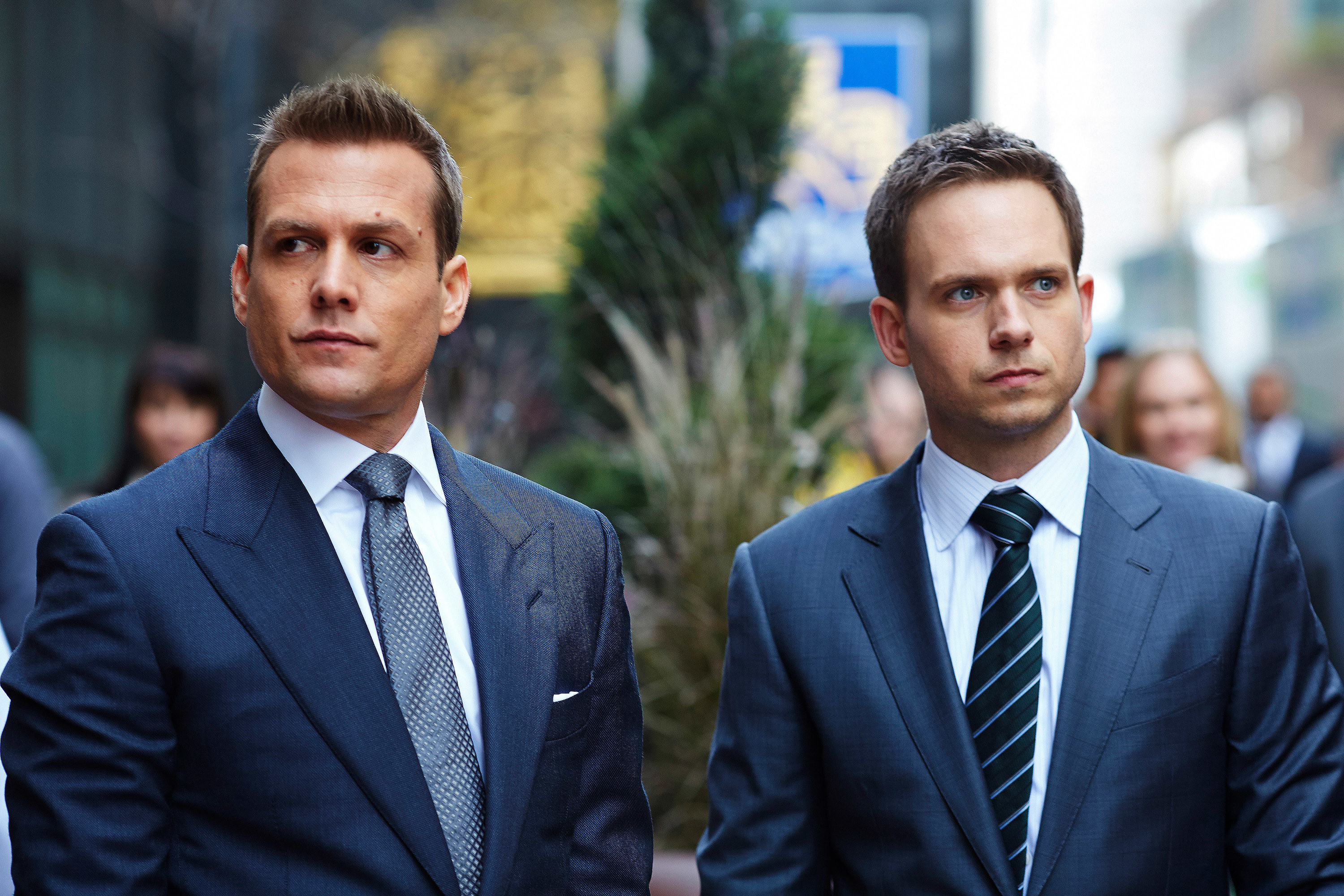 Gabriel Macht and Patrick J. Adams outside in the street