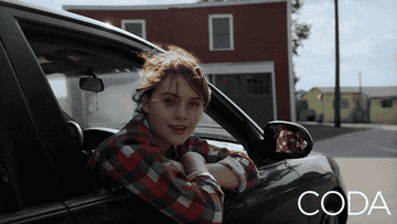 a gif from Coda of Ruby signing her family&#x27;s special sign for &quot;I love you&quot; out of a car window