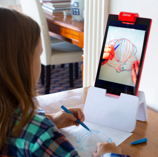Young girl drawing using Osmo's Creative Starter Kit