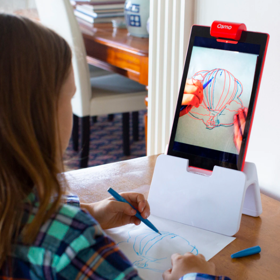 Young girl drawing using Osmo&#x27;s Creative Starter Kit