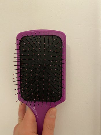 the same hairbrush now completely clean