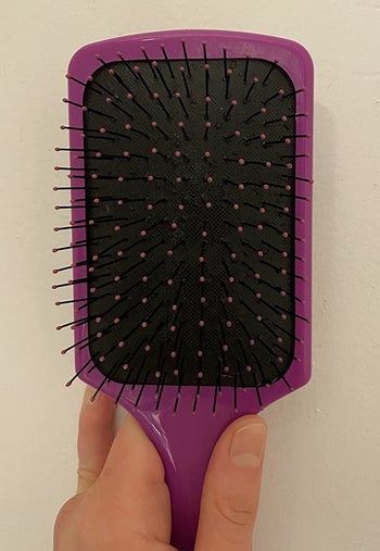 the same hairbrush now completely clean