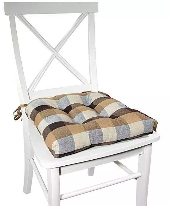 The brown and grey checkered cushion on a white chair