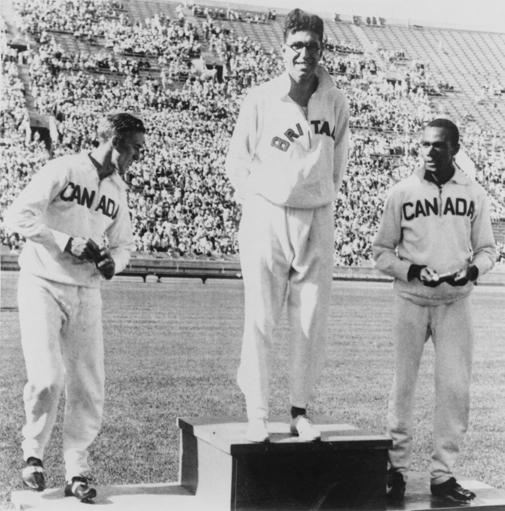 British athlete Tommy Hampson (1907-1965), and Canadian athlete Phil Edwards (1907-1971) on the podium after the final of the Men&#x27;s 800 Metres event at the 1932 Summer Olympics, at the Los Angeles Memorial Coliseum, Los Angeles,