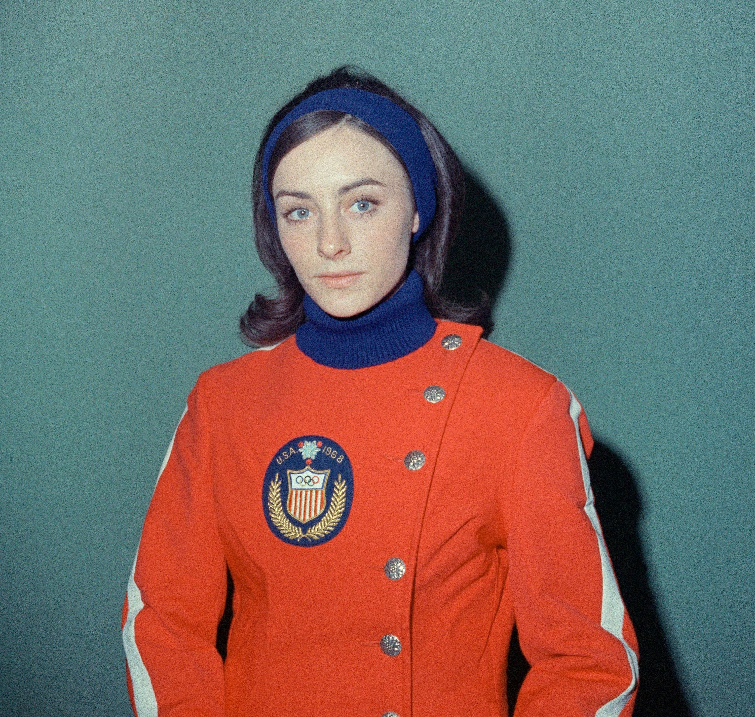 Peggy Fleming National champion and Olympic team figure skating member Peggy Fleming of Boulder Springs, Colo., wears her Olympic parade uniform during fitting session on