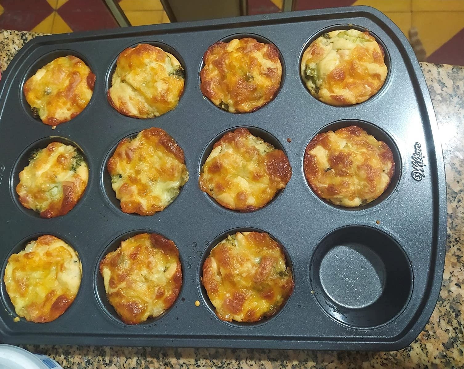 reviewer image of the muffin tin with breakfast muffins in it
