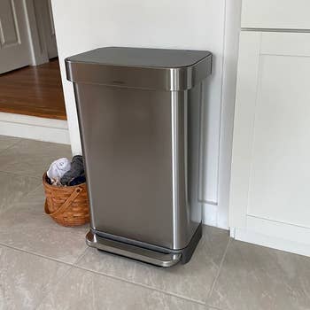a reviewer photo of the trash can in a kitchen