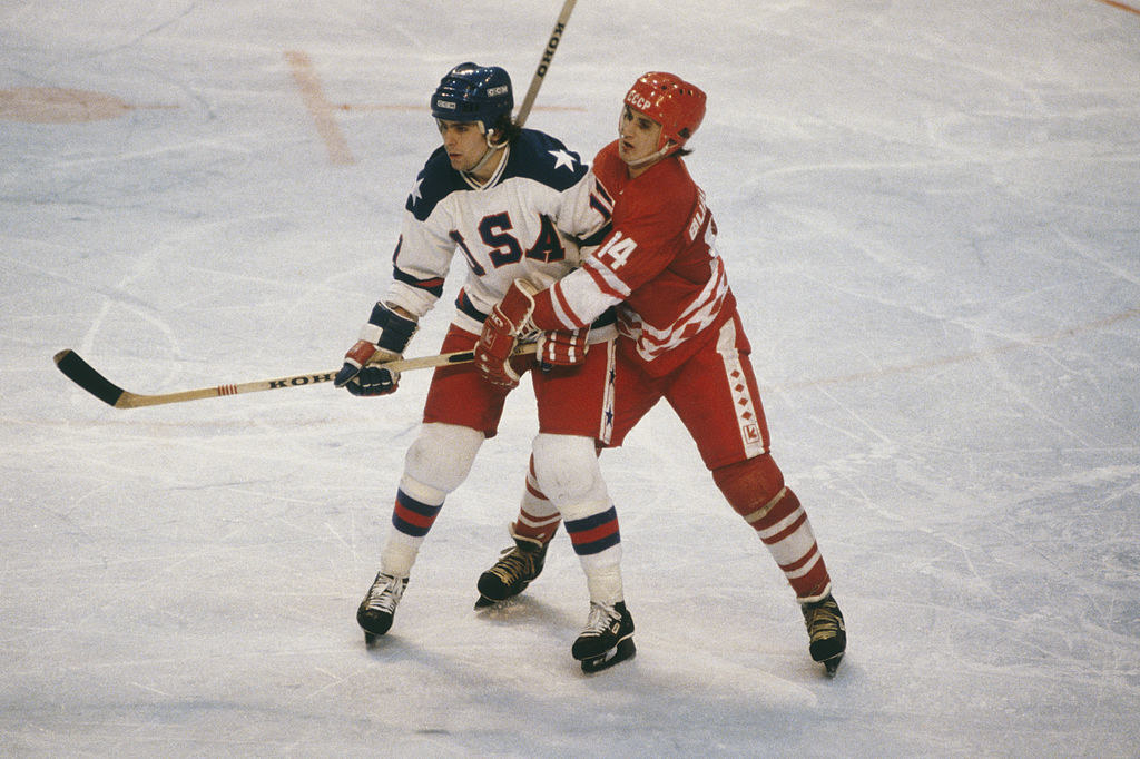 LAKE PLACID, NY - FEBUARY 1980: Team USA&#x27;s Steve Christoff #11 stands his groud against Zinetula Bilyaletdinov #14 of the Soviet Union during the XIII Olympic Winter Games in February of 1980 in Lake Placid, New York.