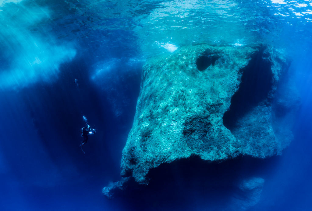 underwater view with a scuba diver in the waters of the Scandola marine reserve