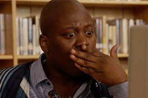 Titus from "Unbreakable Kimmy Schmidt" covers his mouth in shock
