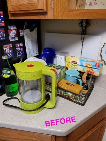 Reviewer before photo of a bunch of boxes of tea bags taking up a lot of counter space