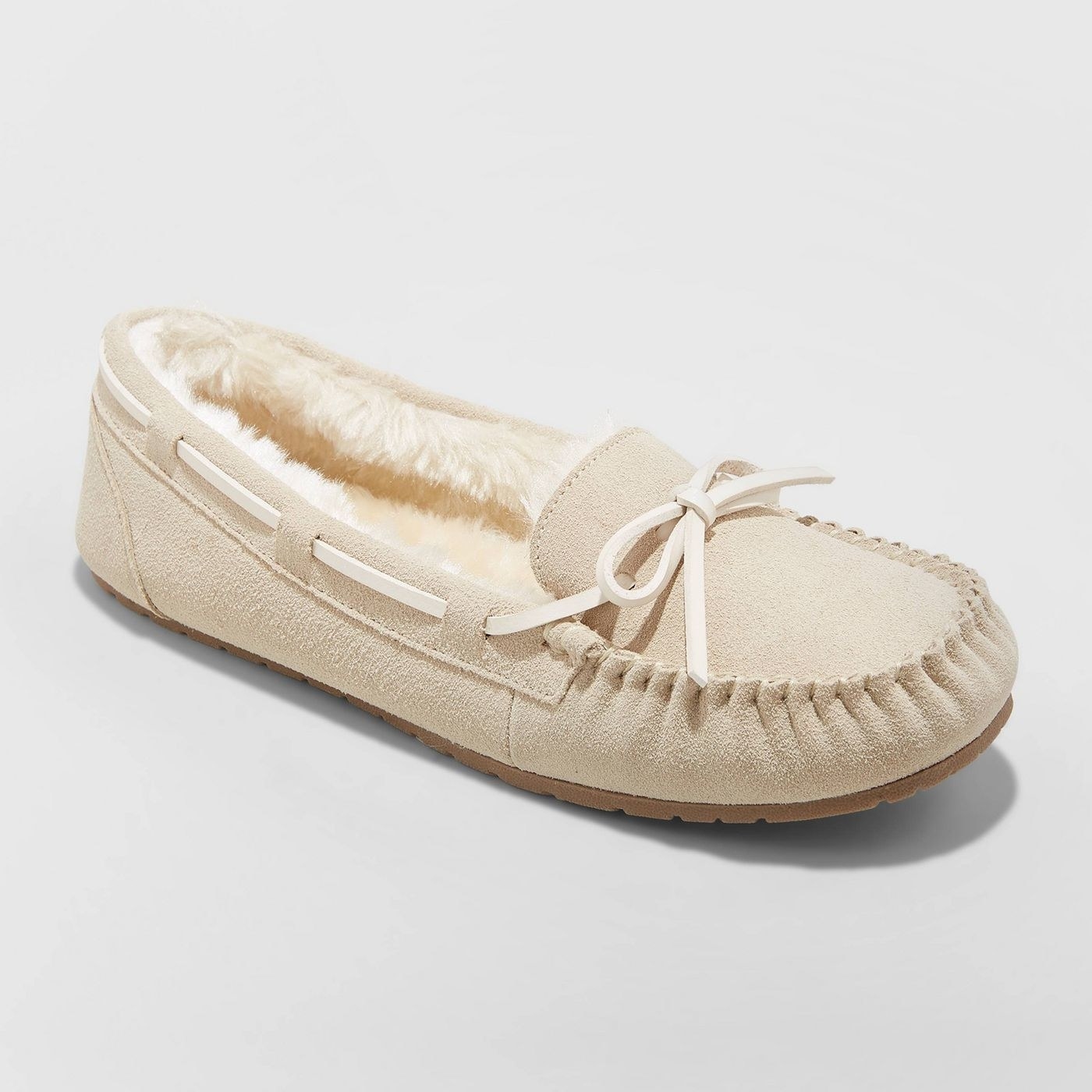 A sand suede moccasin slipper