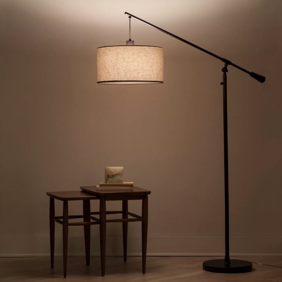 Floor lamp over wooden end table