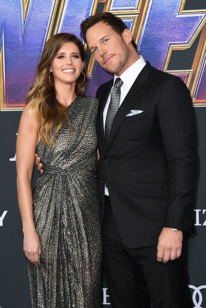 The couple poses for photos at a movie premiere
