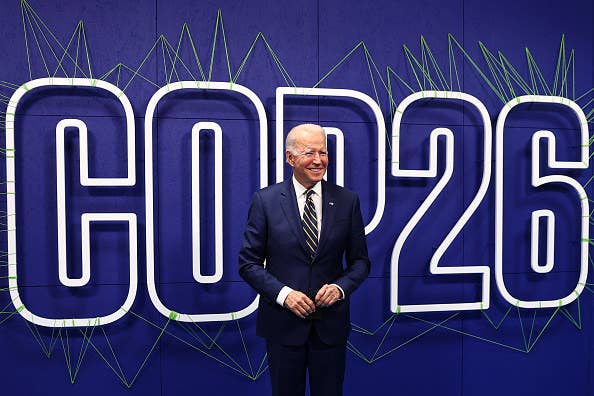 An image of President Joe Biden in front of a sign that says &quot;COP26&quot;