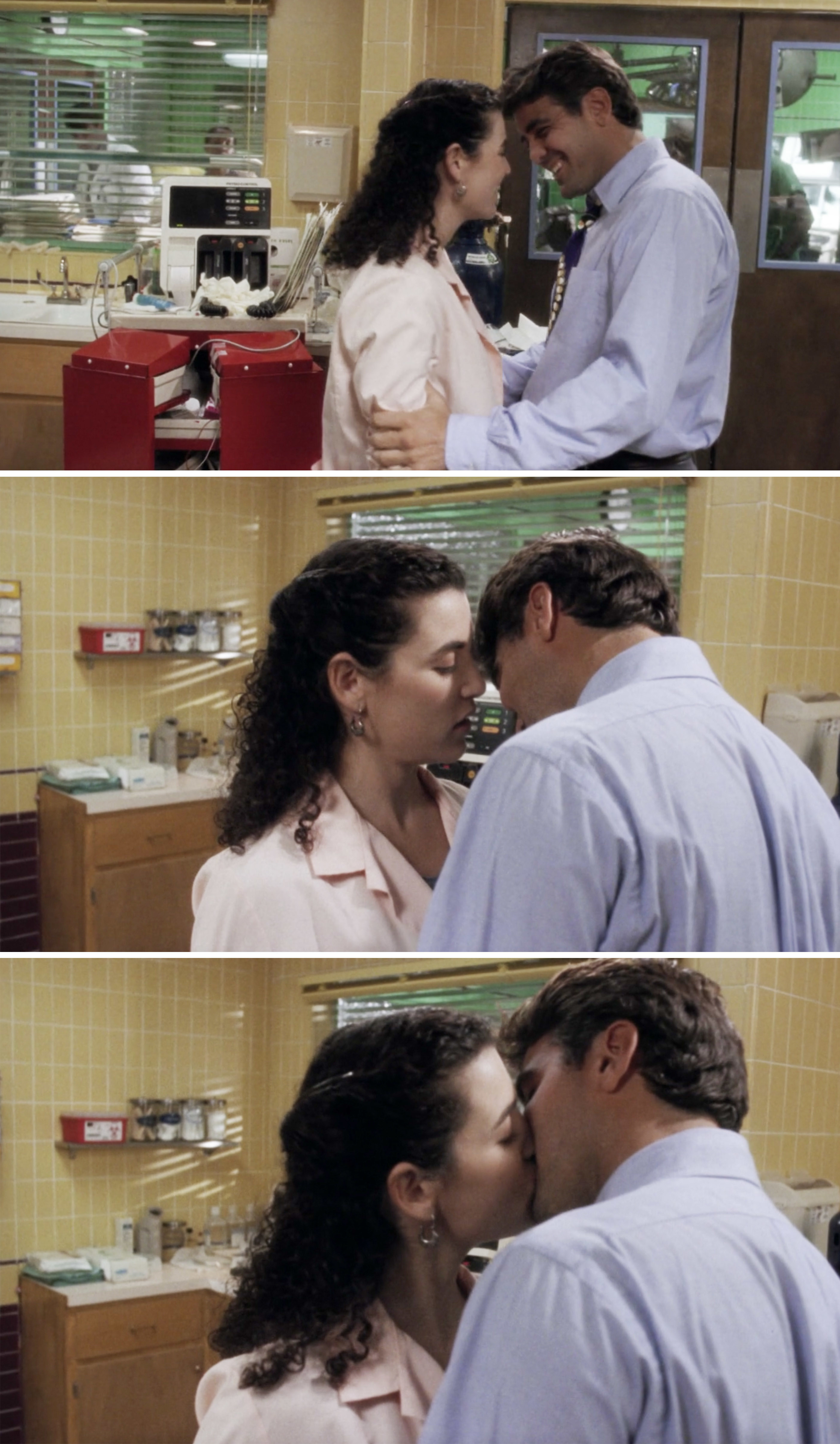 Carol and Doug kissing in an operating room