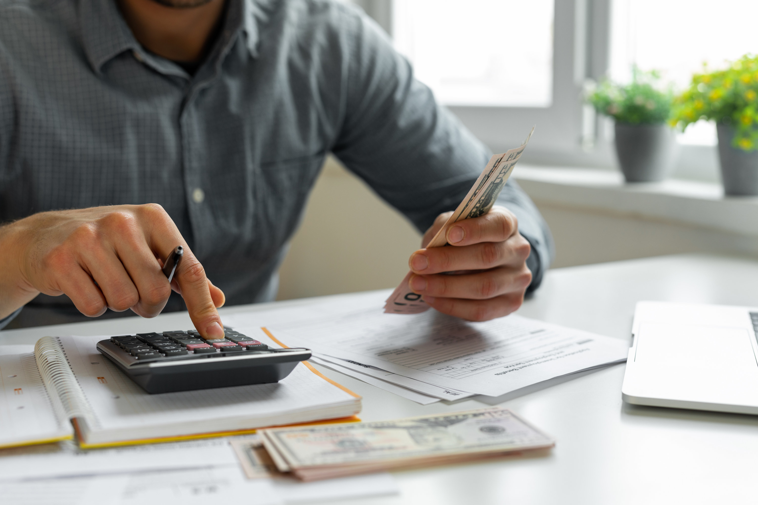 Man using a calculator