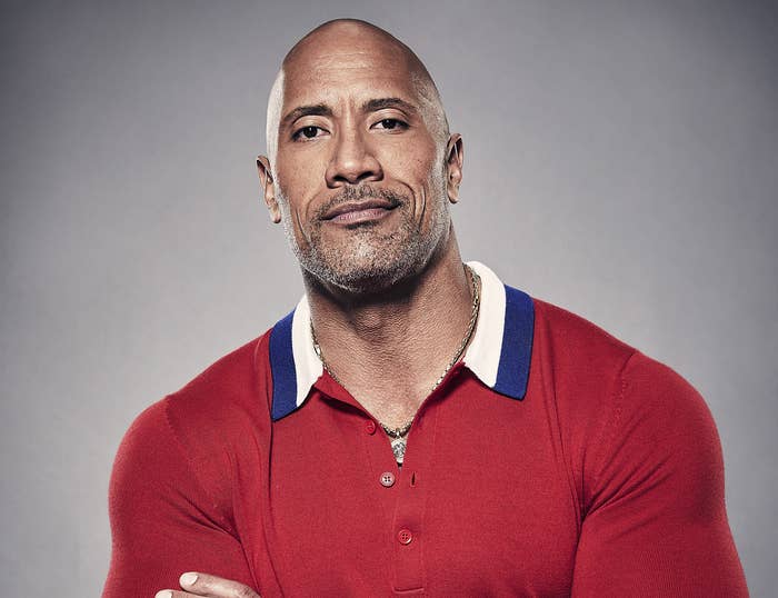 Dwayne poses for a photo in a red polo