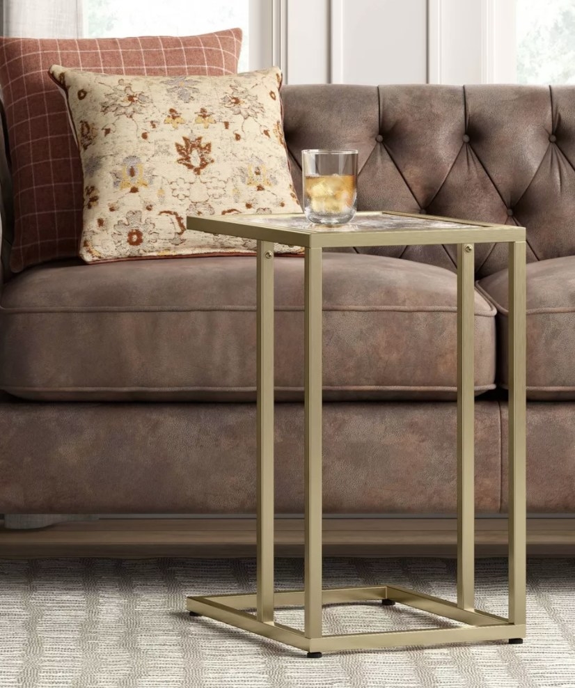 Glass C table with brass legs