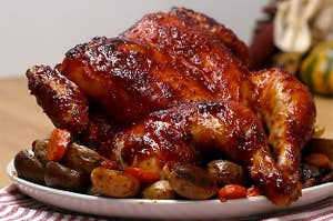 Photo of a whole glazed chicken on a plate.