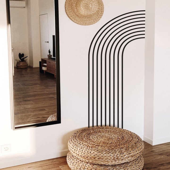 arch wall decal in black beside a mirror