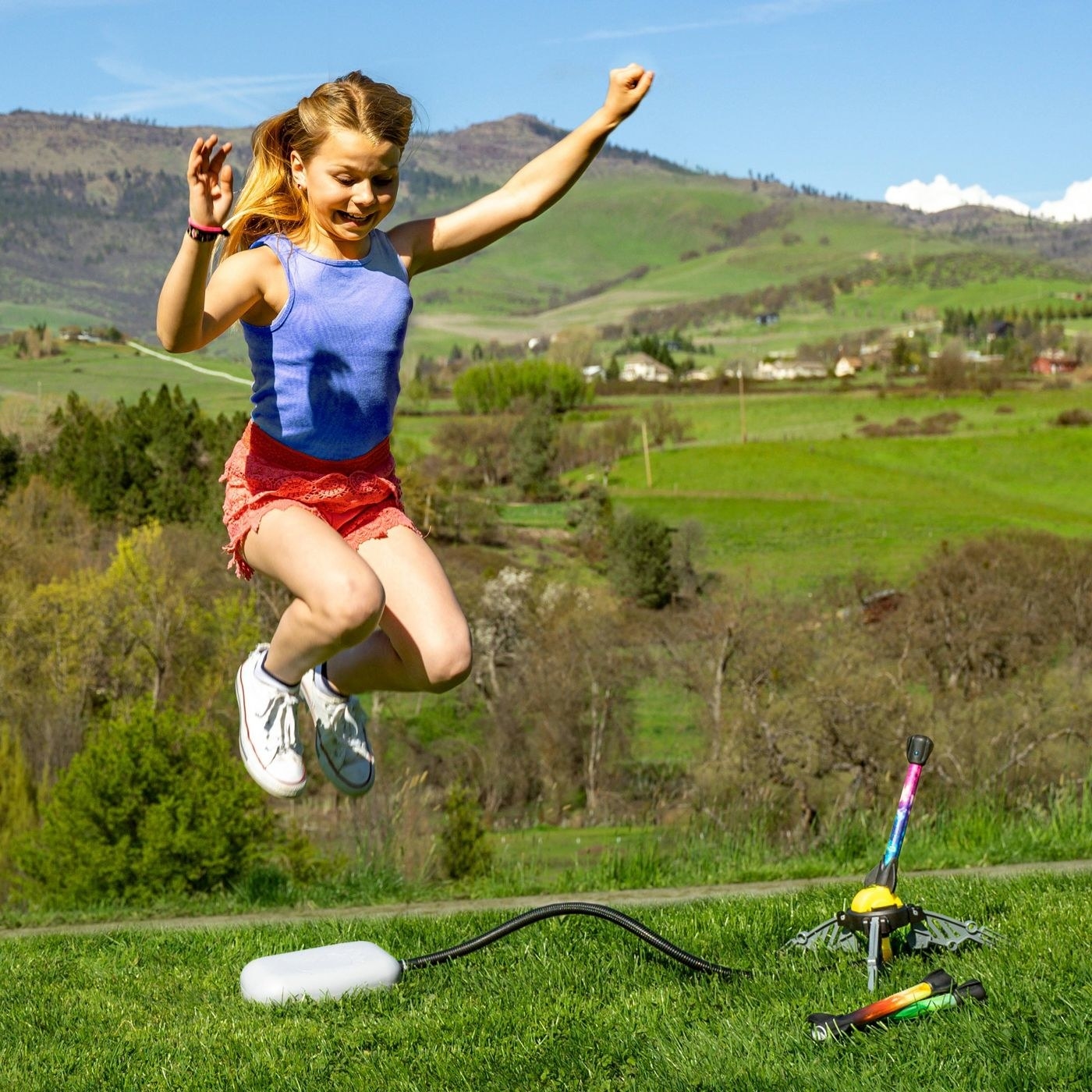 Girl jumping on air rocket