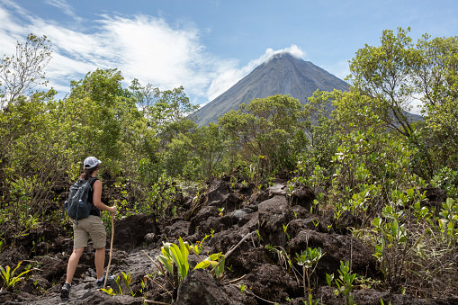 A woman hiking near the Arenal volcano