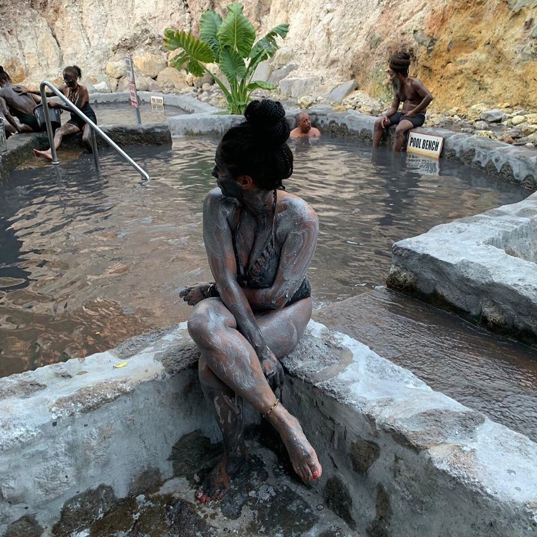 Tourists bathing in the Sulphur Springs Mud Bath in St. Lucia