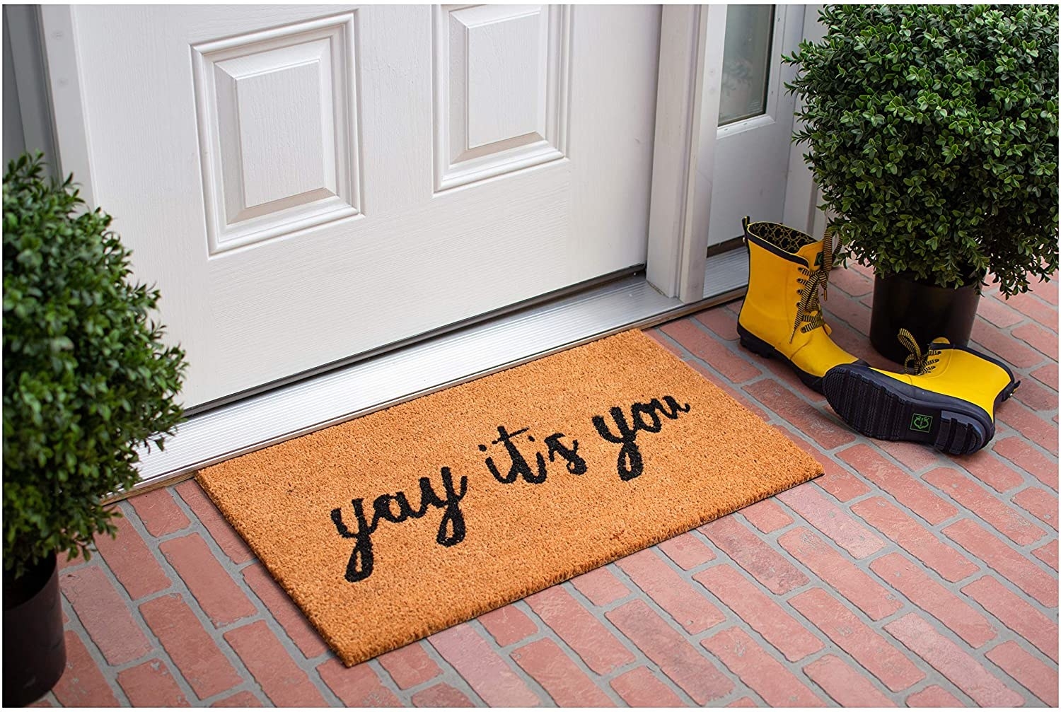 brown doormat with black writing reading &quot;yay it&#x27;s you&quot;