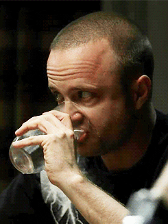 Jessie looking awkward and drinking water in Breaking Bad