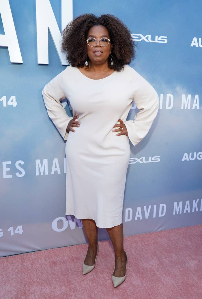 Oprah poses on a red carpet