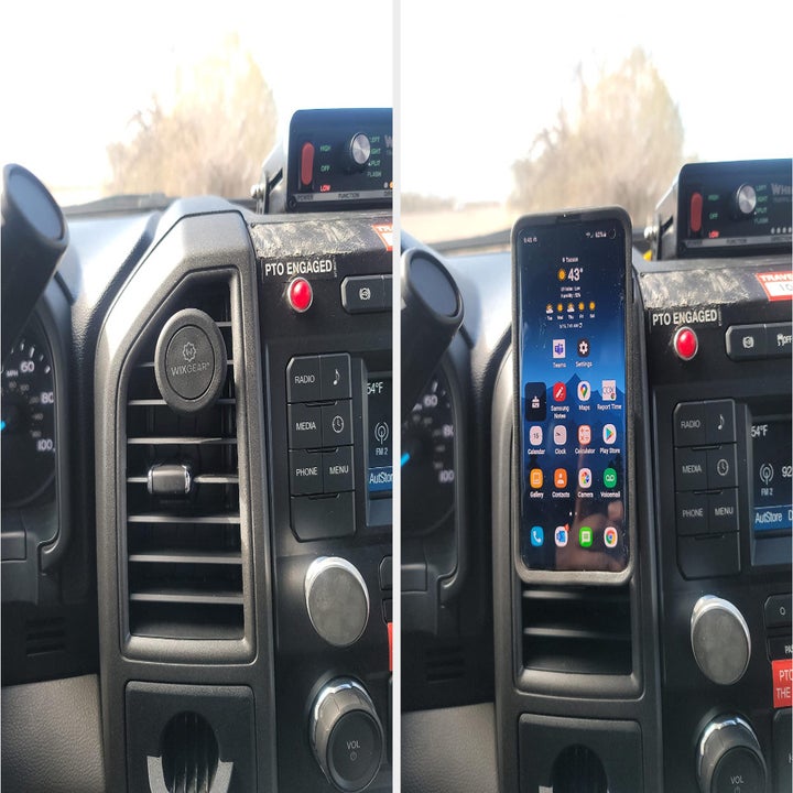 Reviewer photo of the magnetic mount in their vent and their phone mounted to it