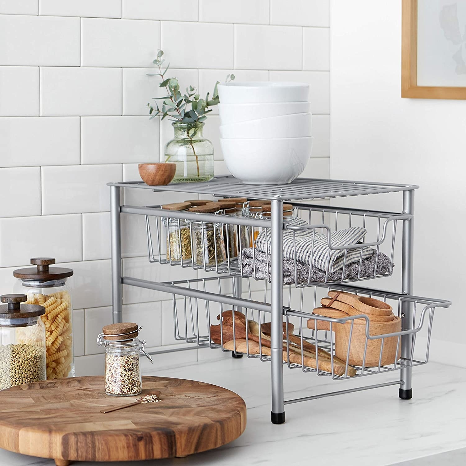 A silver storage unit with two sliding baskets