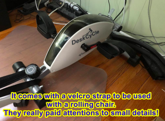 A reviewer photo of the cycle, with the text &quot;It comes with a velcro strap to be used with a rolling chair. They really paid attention to small details!&quot;