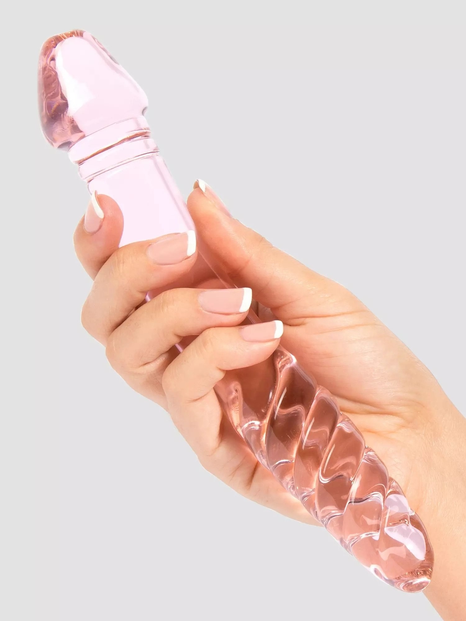 Model holding pink dual-ended dildo
