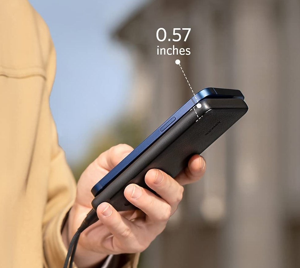 model holding charger next to phone, with diagram showing the charger is 0.57 inches thick