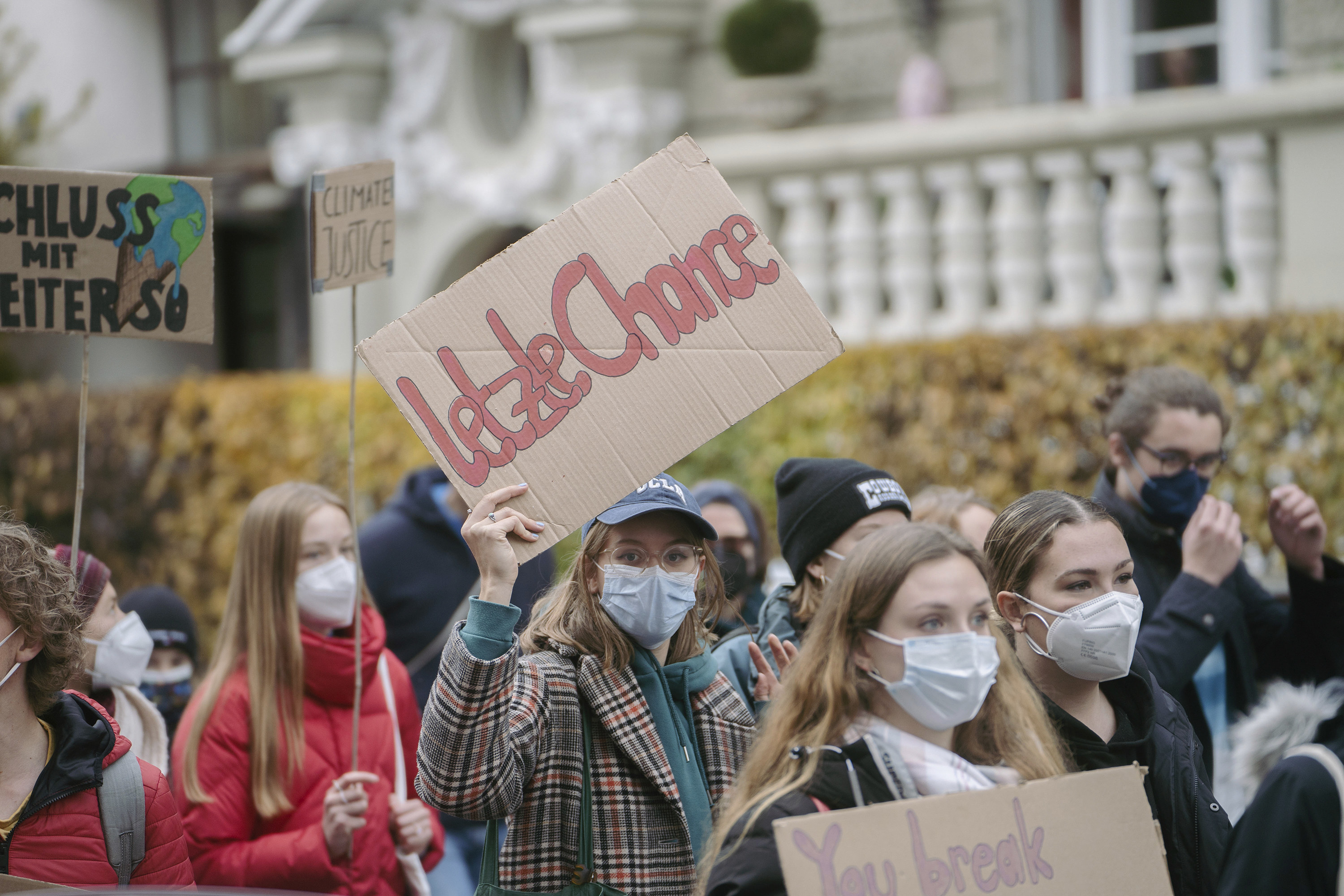 Demonstrator with sign that reads &quot;Last chance&quot; on November 5th, 2021