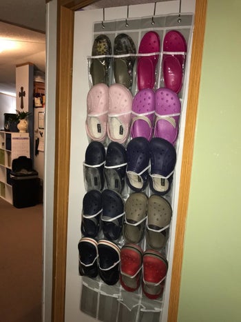 Reviewer photo of their shoes organized in the hanging shoe rack